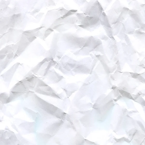 Wrinkled crumpled paper texture or background.  Texture of crumpled paper.  White paper sheet.