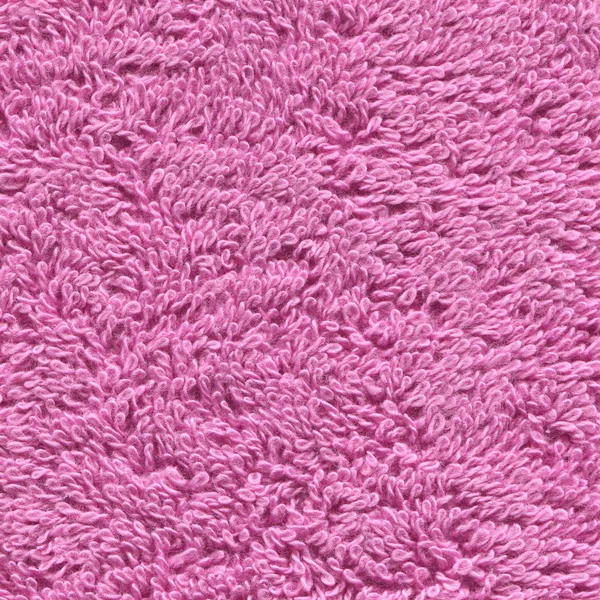 Pink color bath towel texture. Pink cloth bath towel background. Soft pink texture of  towel