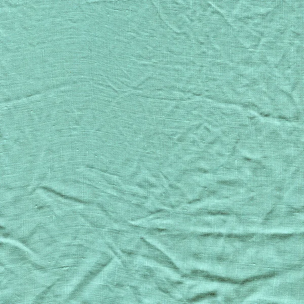 Turquoise fabric background texture. Turquoise background from a textile material