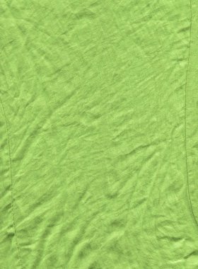 Arka plan için yeşil kumaş yüzeyi. Yeşil keten doku. Değişik kullanım amaclı arka planı yeşil