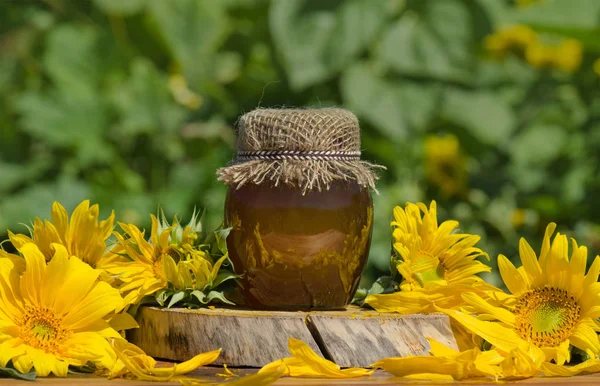 Jar of honey on wooden table