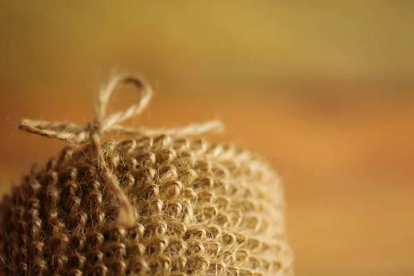 Eco friendly jute washcloth. Sustainable lifestyle concept. Brown body washcloth