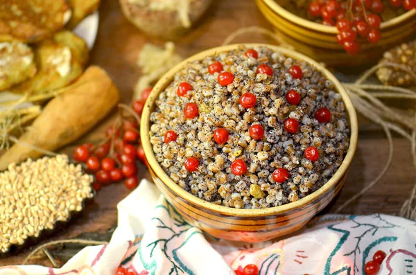 Memorial Christmas ritual dish in Ukraine. Traditional Christmas kutya. Christmas slavs dish kutia on festive table.