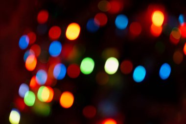 Kopya alanı ile soyut dairesel bokeh arkaplanı. Siyah arkaplanda soyut parlak bokeh. Parıldayan odaklanmış ışık arkaplanı. 