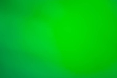 Soyut eğimli yeşil bulanık arkaplan. Canlı yeşil gradyan renkler sürrealizm arka planını bulanıklaştırır