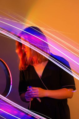 Blogger content creator using mobile phone gadget. Woman blogger influencer creating vlog video for social media.