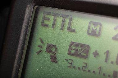 E-TTL mode screen of a camera flash clipart
