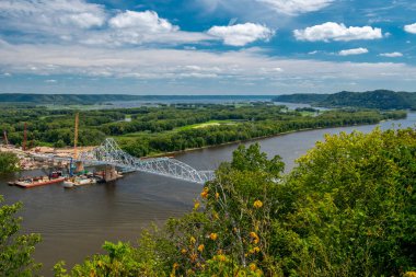 Mississippi River bridge connecting Lansing, Iowa to Wisconsin in summer, showing the river and surrounding landscape before its planned removal.
