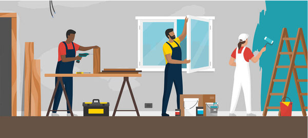 Professional contractors working on a home renovation, construction, windows installation and painting