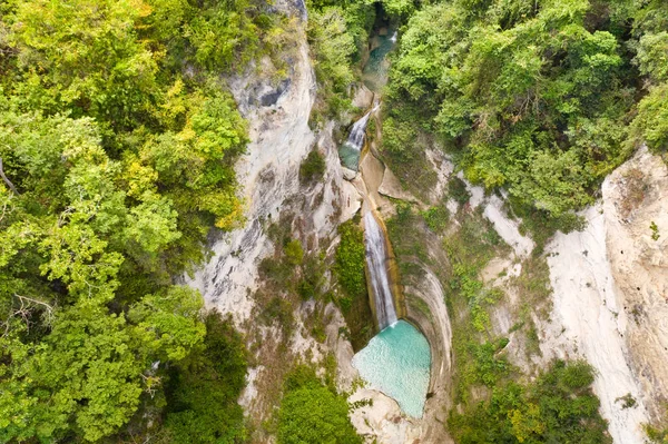 Waterfall in the rainforest jungle from above. Tropical Dao waterfalls in mountain jungle. Philippines, Cebu