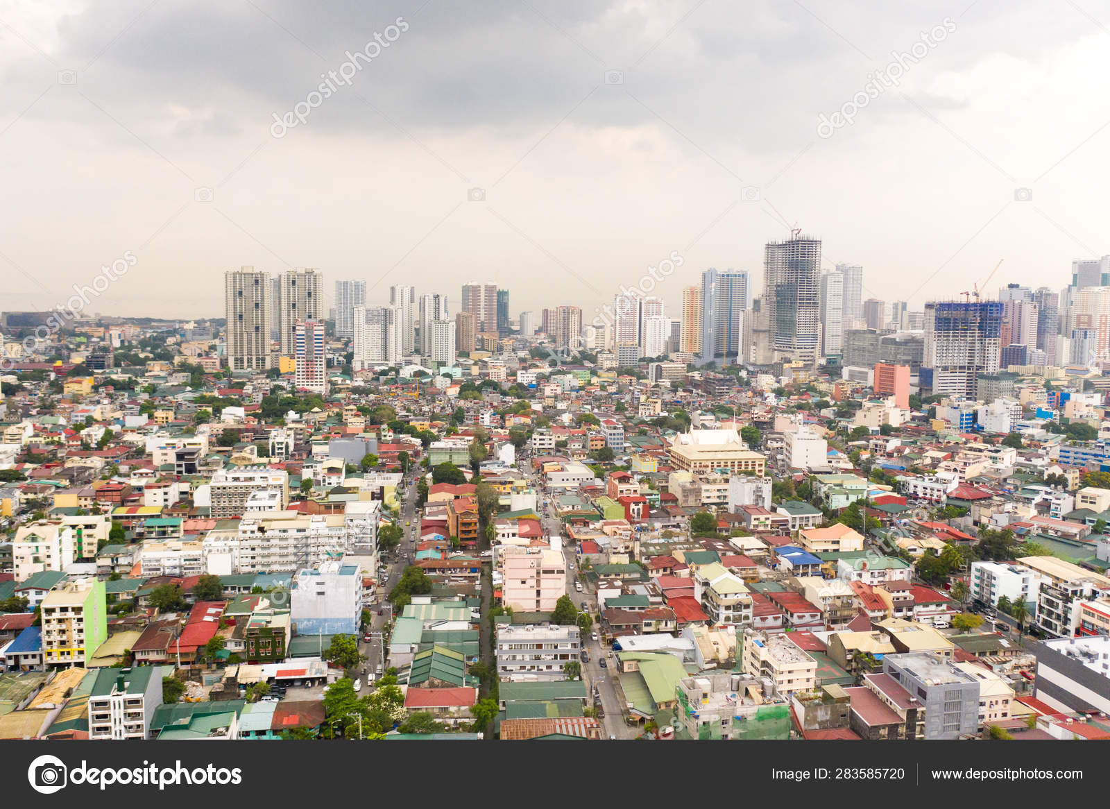 Residential areas and streets of Manila, Philippines, top view. Roofs of  houses and roads. Stock Photo by ©TaianaNur 283585720