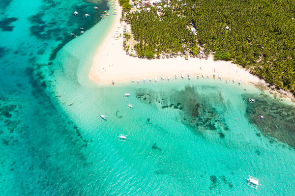 Beautiful tropical island in sunny weather, view from above. Daco island, Philippines.