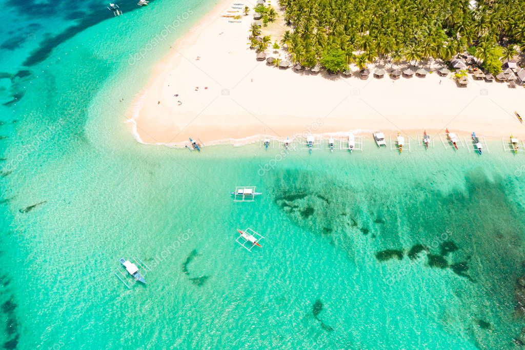 Beautiful tropical island in sunny weather, view from above. Daco island, Philippines.