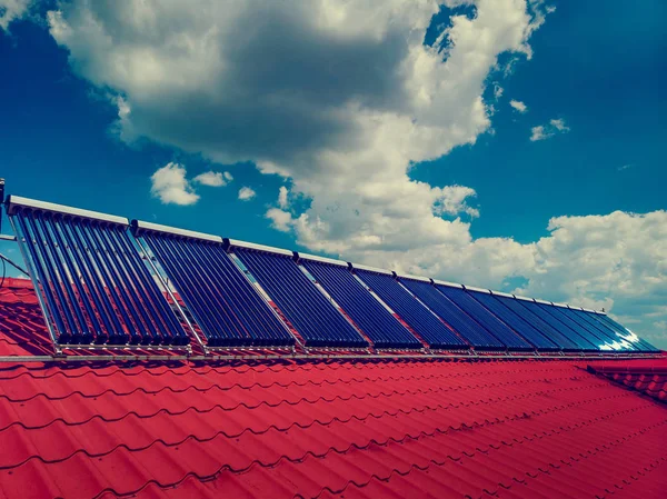 Residential red roof tile with with solar panel