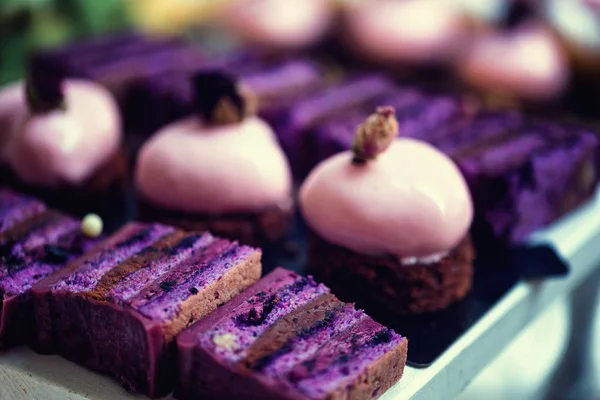 Purple velvet cake with vegan white chocolate icing and macaroons