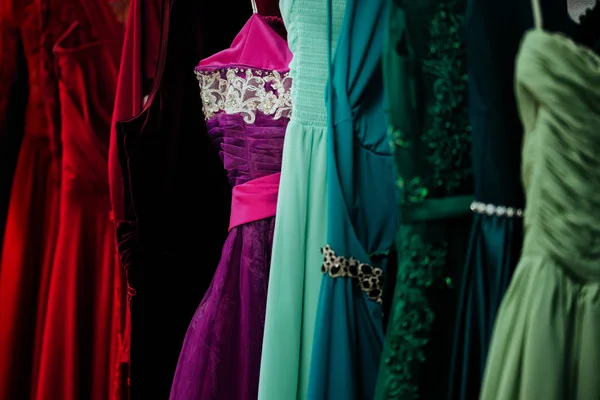 Colorful dresses on rack dress shop