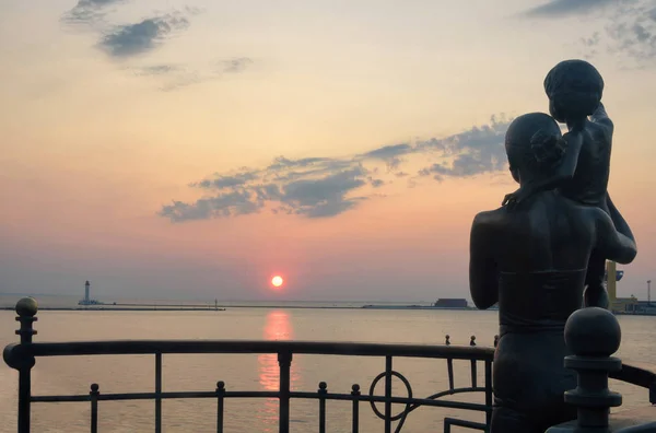 Odessa sea terminal summer, sunrise.Monument to the sailor\'s wife.