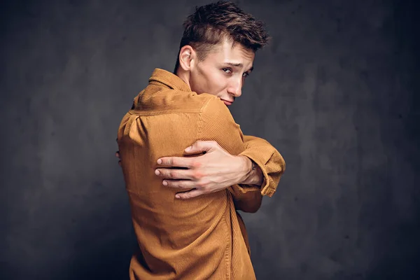Back view of man clenched hands on dark background — Stock Photo, Image