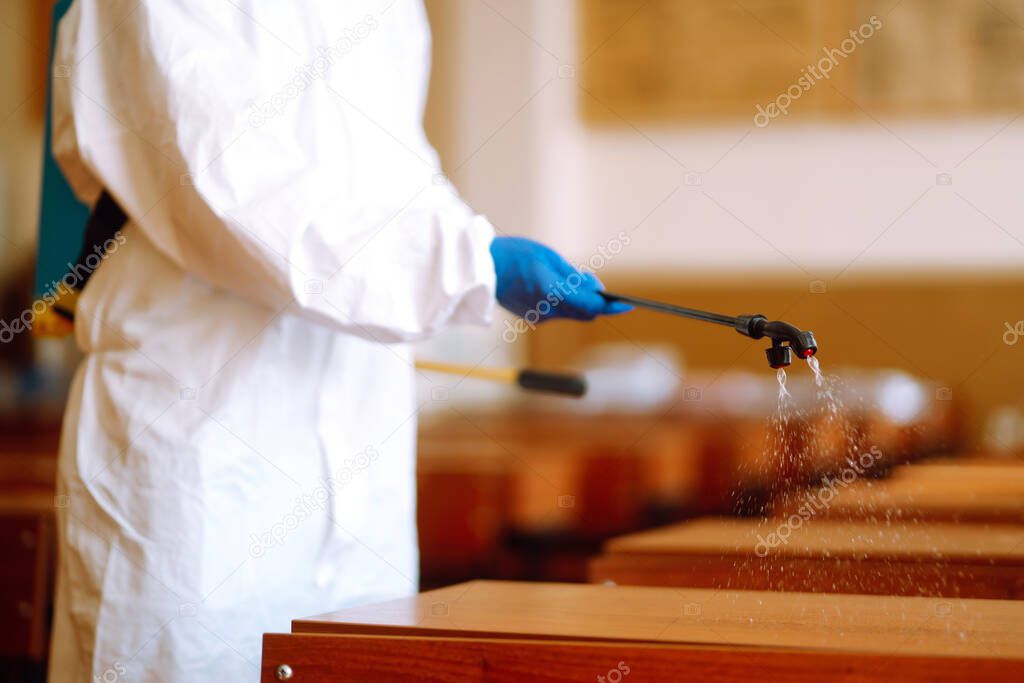 Disinfectant sprayers with spray chemicals in school class. COVID-19.