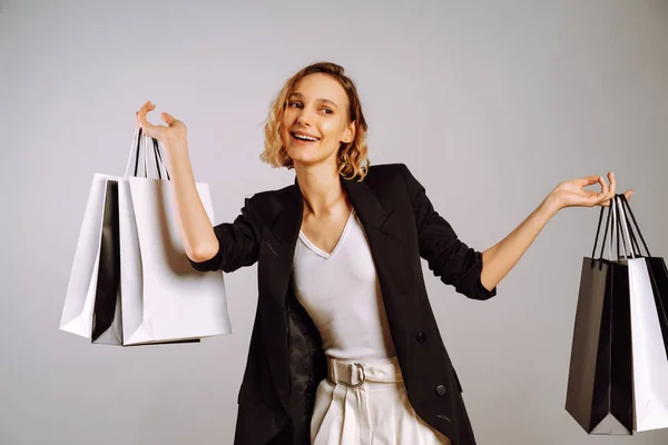 Portrait of nice charming woman with shopping bags. Sale, fashion, black friday and luxury concept.