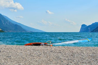 sailing and surfing board beach at blue sea water 