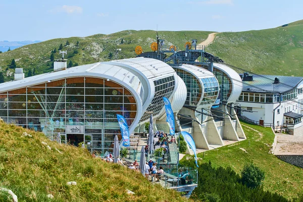 people in summer season, Cable car station Monte Baldo