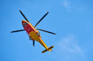 helicopter flying in blue day sky 