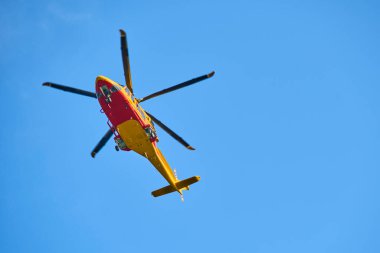helicopter flying in blue day sky 