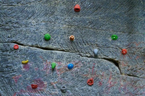climbing mountain wall, climbing wall with colorful Jugs