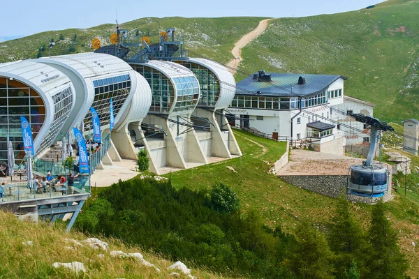 people in summer season, Cable car station Monte Baldo