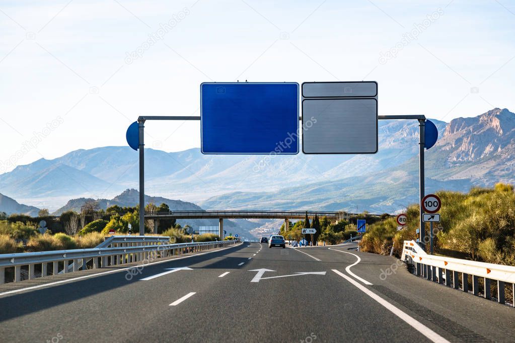 Spanish highway in front of mountains Sierra Nevada