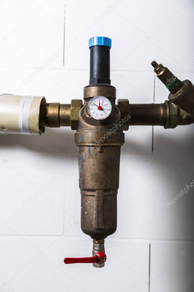 Water meters on metallic rusty water pipe