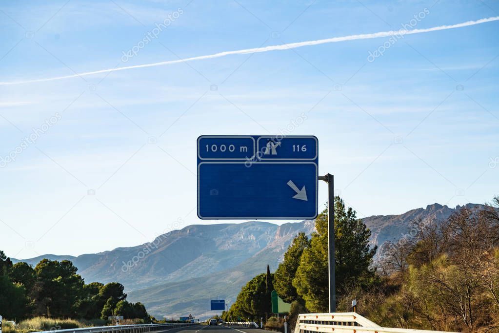 Spanish highway in front of mountains Sierra Nevada