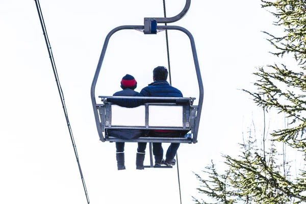 Cable car with two people going up on funicular in Sierra Nevada mountains — Stock Photo, Image