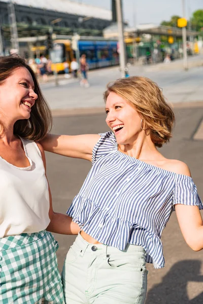 Portrait of two girlfriends hugging each other — Stock Photo, Image