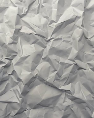 Gri kırışıklıklar ve gölgeli buruşuk kağıt dokusu, grunge markalaşması, kenar posterler ve alternatif tasarım projeleri için mükemmel..