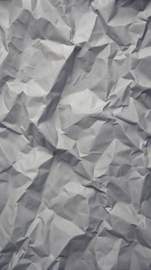 Gri kırışıklıklar ve gölgeli buruşuk kağıt dokusu, grunge markalaşması, kenar posterler ve alternatif tasarım projeleri için mükemmel..