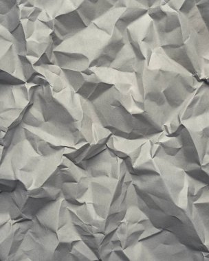 Gri kırışıklıklar ve gölgeli buruşuk kağıt dokusu, grunge markalaşması, kenar posterler ve alternatif tasarım projeleri için mükemmel..