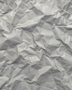 Gri kırışıklıklar ve gölgeli buruşuk kağıt dokusu, grunge markalaşması, kenar posterler ve alternatif tasarım projeleri için mükemmel..