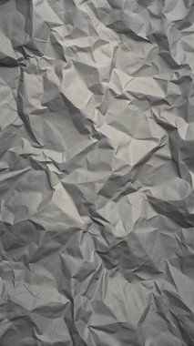 Gri kırışıklıklar ve gölgeli buruşuk kağıt dokusu, grunge markalaşması, kenar posterler ve alternatif tasarım projeleri için mükemmel..