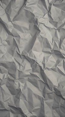 Gri kırışıklıklar ve gölgeli buruşuk kağıt dokusu, grunge markalaşması, kenar posterler ve alternatif tasarım projeleri için mükemmel..