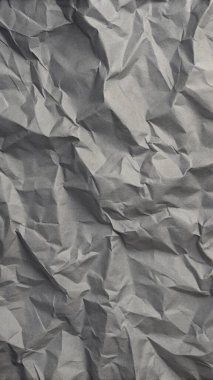 Gri kırışıklıklar ve gölgeli buruşuk kağıt dokusu, grunge markalaşması, kenar posterler ve alternatif tasarım projeleri için mükemmel..