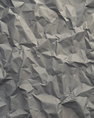 Gri kırışıklıklar ve gölgeli buruşuk kağıt dokusu, grunge markalaşması, kenar posterler ve alternatif tasarım projeleri için mükemmel..
