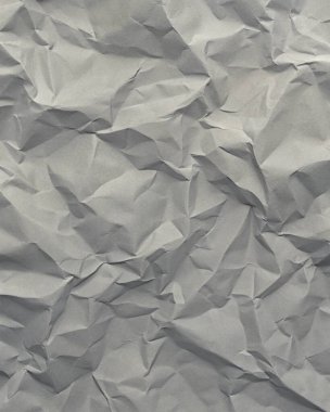 Gri kırışıklıklar ve gölgeli buruşuk kağıt dokusu, grunge markalaşması, kenar posterler ve alternatif tasarım projeleri için mükemmel..