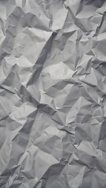 Gri kırışıklıklar ve gölgeli buruşuk kağıt dokusu, grunge markalaşması, kenar posterler ve alternatif tasarım projeleri için mükemmel..