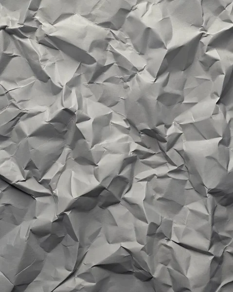 Gri kırışıklıklar ve gölgeli buruşuk kağıt dokusu, grunge markalaşması, kenar posterler ve alternatif tasarım projeleri için mükemmel..