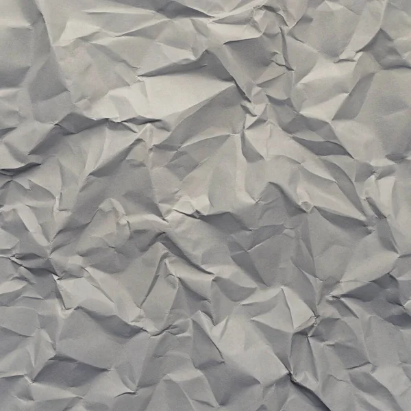 Gri kırışıklıklar ve gölgeli buruşuk kağıt dokusu, grunge markalaşması, kenar posterler ve alternatif tasarım projeleri için mükemmel..