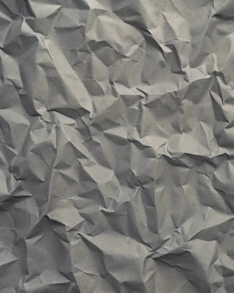 Gri kırışıklıklar ve gölgeli buruşuk kağıt dokusu, grunge markalaşması, kenar posterler ve alternatif tasarım projeleri için mükemmel..