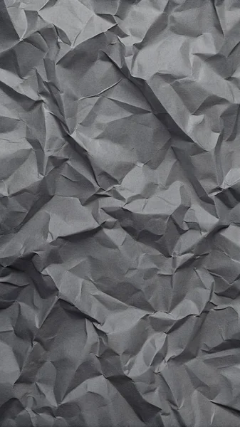 Gri kırışıklıklar ve gölgeli buruşuk kağıt dokusu, grunge markalaşması, kenar posterler ve alternatif tasarım projeleri için mükemmel..