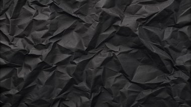 Buruşuk kağıt kırışıklıkları olan şık siyah doku, editör tasarımı için mükemmel, modern posterler, ve yaratıcı grafik projeleri.